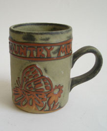  1960s TREMAR STUDIO POTTERY COUNTRY MUG WITH RAISED BUTTERFLY  DESIGN